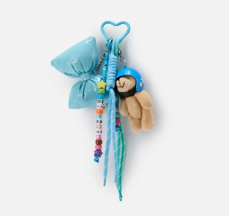 Funny Charm con fiocco imbottito e teddy decorativo