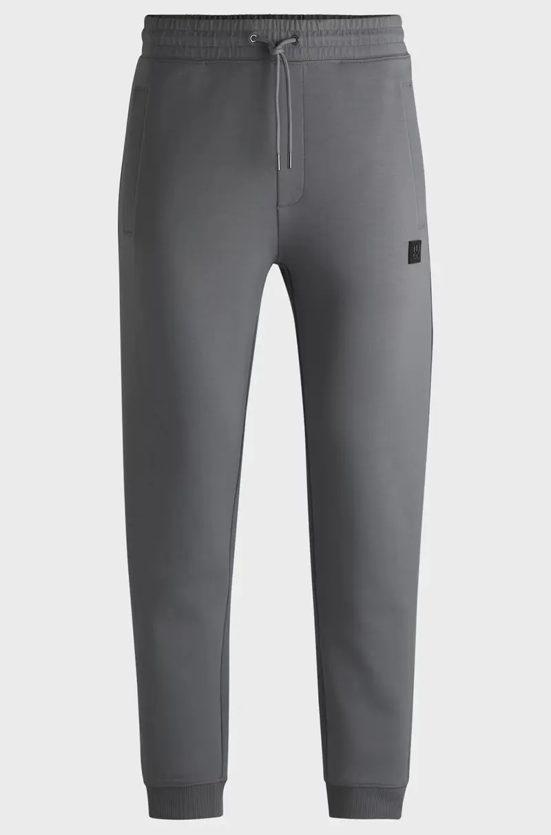 Pantaloni della tuta in misto cotone con logo scomposto