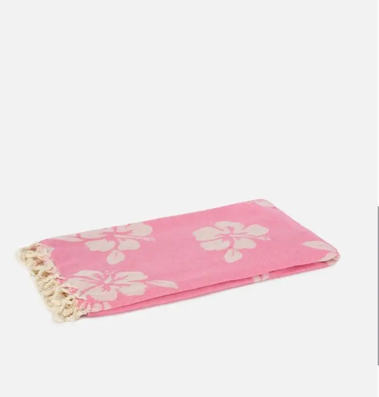 Telo mare Foutas in cotone jacquard rosa con fantasia hibiscus