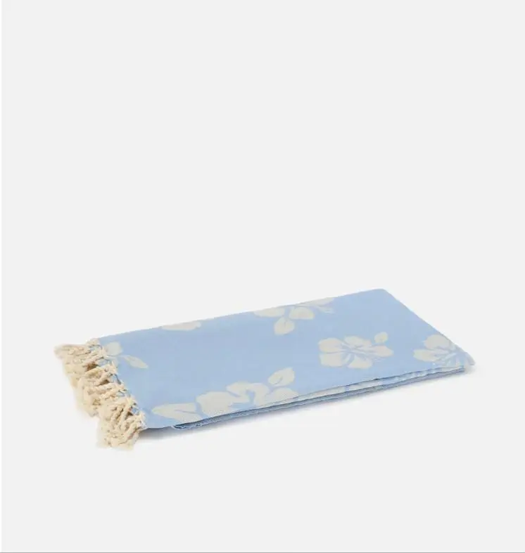 Telo mare Foutas in cotone jacquard rosa con fantasia hibiscus